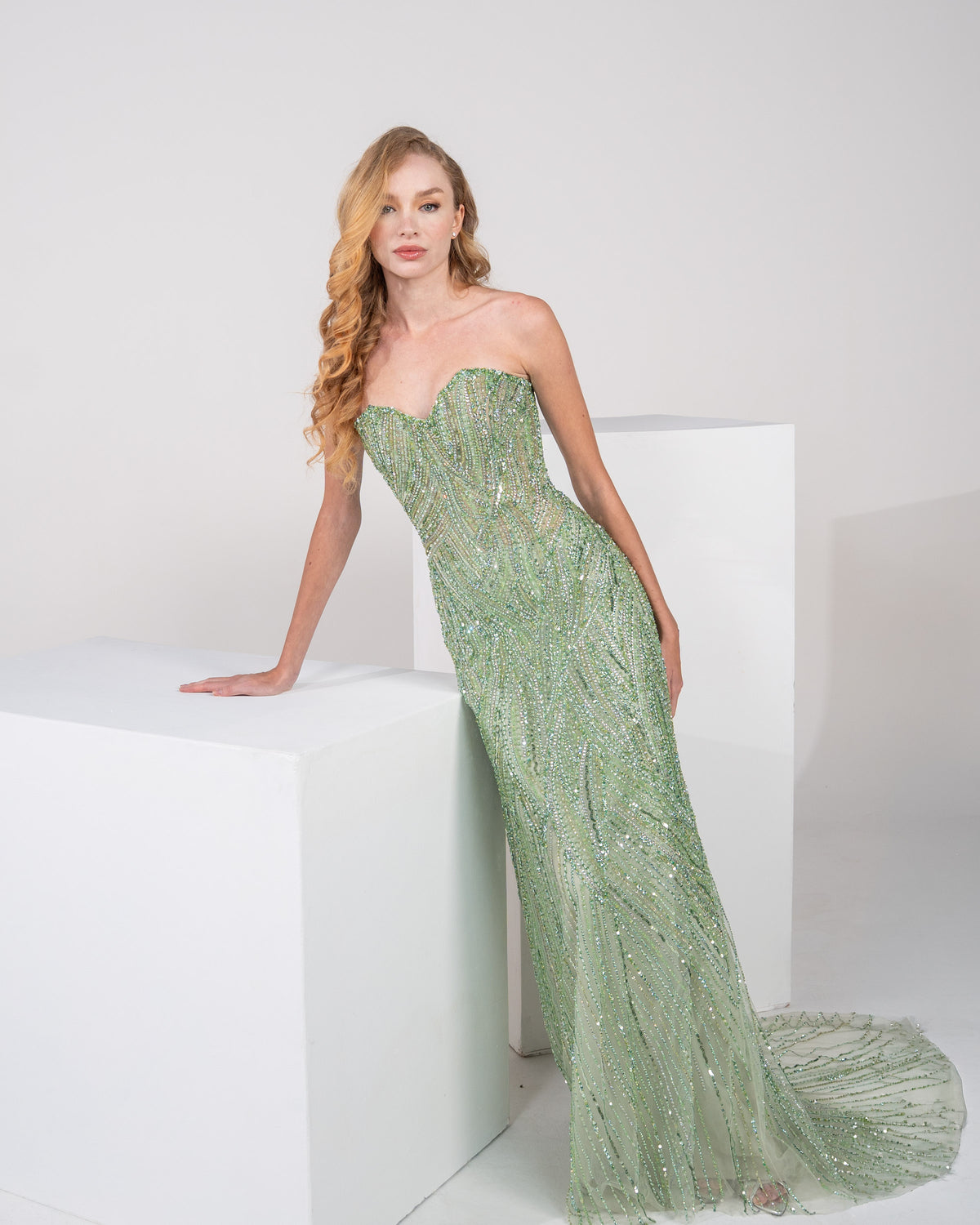 Fully hand-embroidered in a rich green shade.
