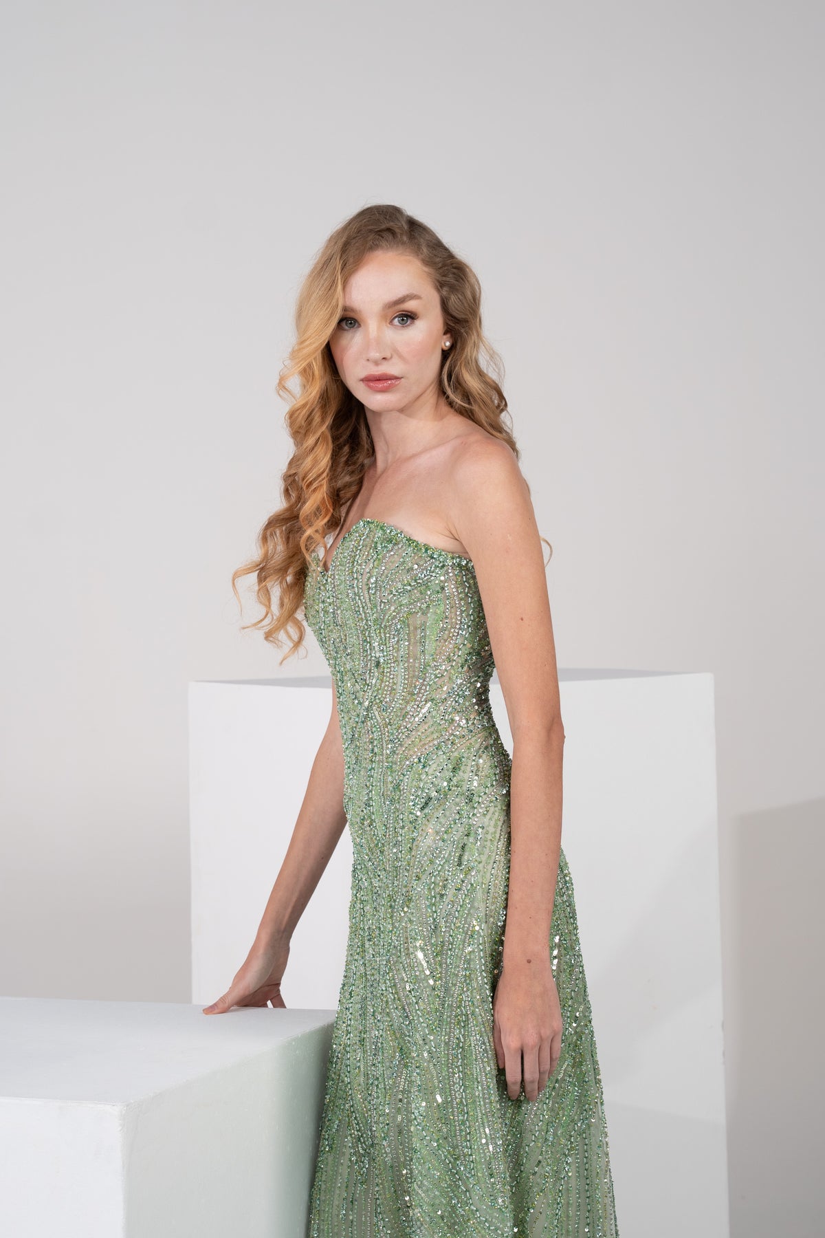 Fully hand-embroidered in a rich green shade.