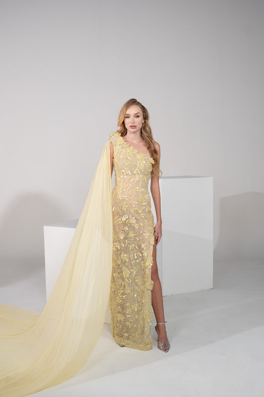 A yellow floral gown with delicate chiffon on the side and side slit.