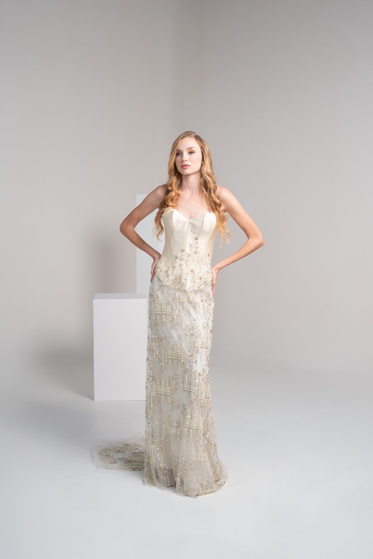 Off white dress featuring a structured mikado top and embroidered.