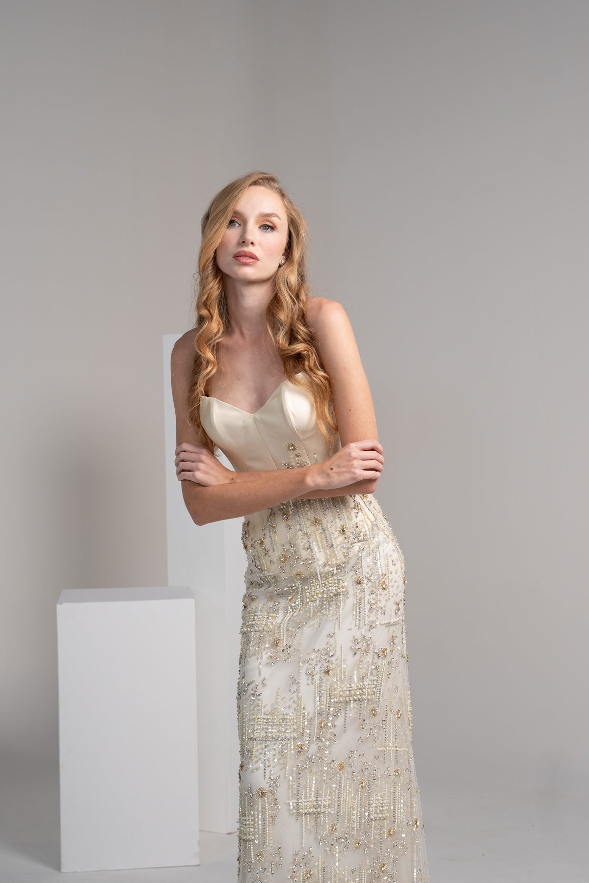 Off white dress featuring a structured mikado top and embroidered.