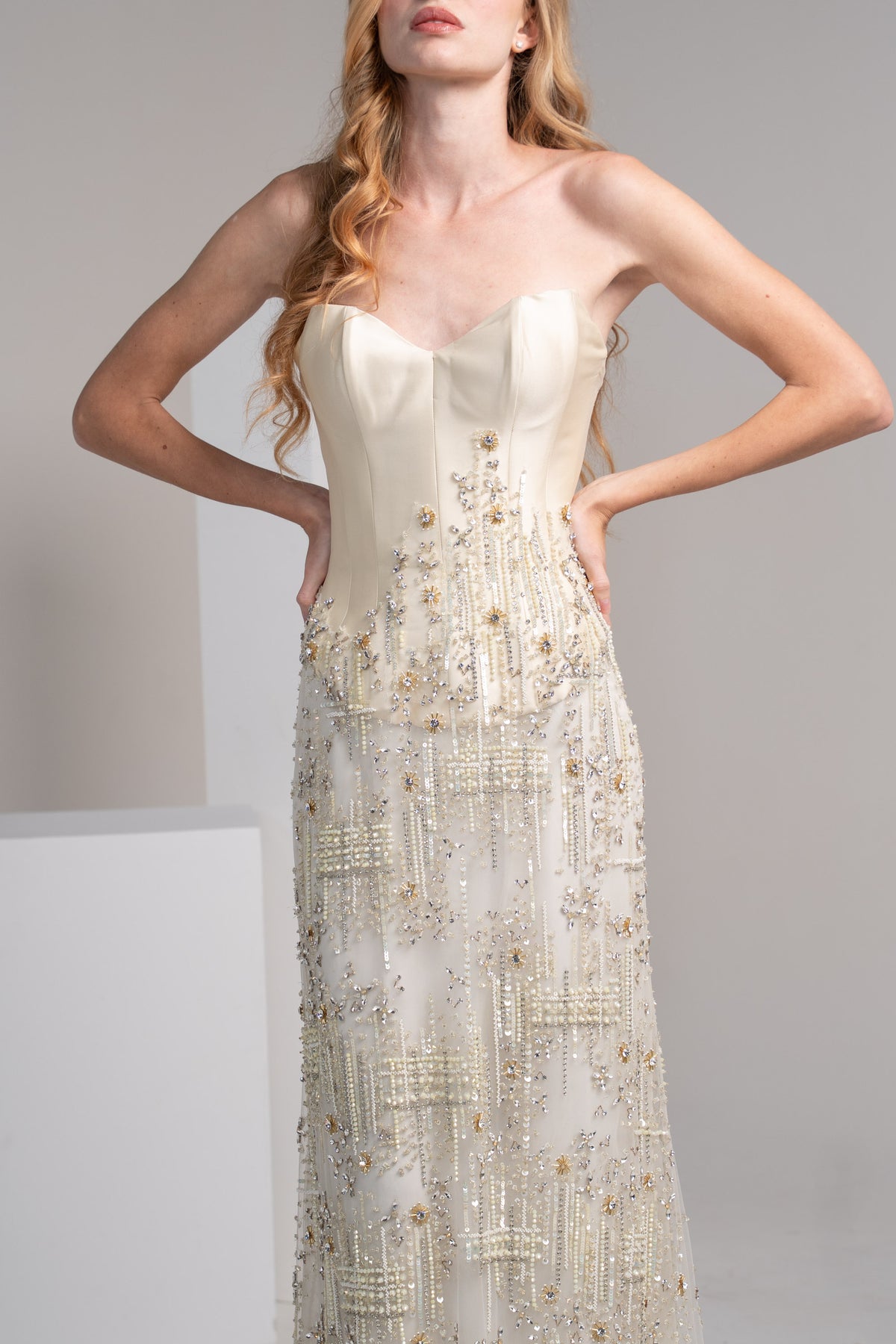 Off white dress featuring a structured mikado top and embroidered.