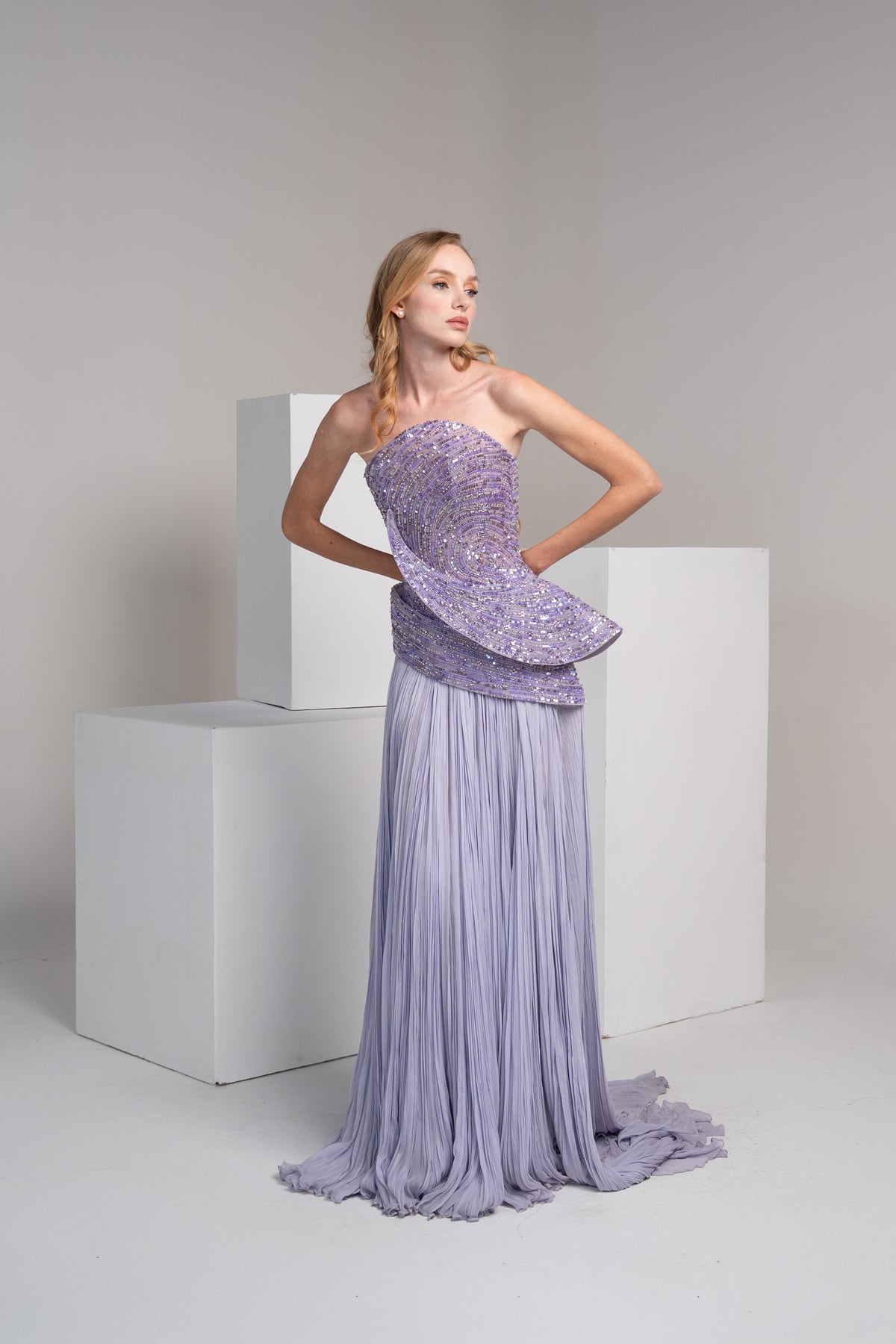 Purple beaded bodice with a pleated chiffon skirt.